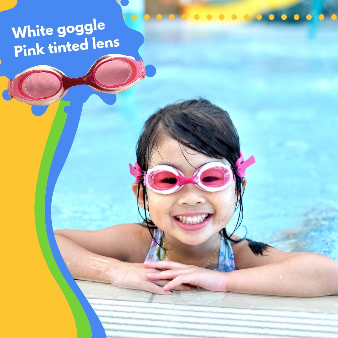 Young girl wearing pink Frogglez swim goggles sitting in swimming pool laughing. Text reads White goggle pink tinted lens.