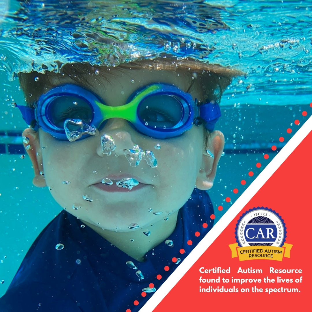 Young boy underwater blowing bubbles wearing blue frogglez goggles with green nose bridge. Text reads certified autism resource found to improve lives of individuals on the spectrum.