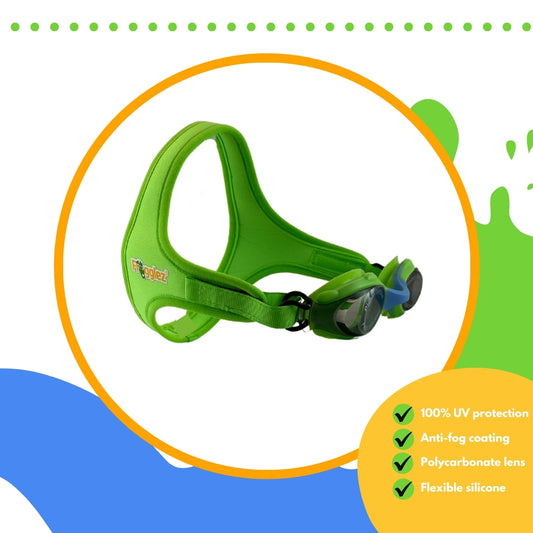 Green Frogglez swimming goggles with grey lenses and blue nose bridge on white background surrounded by orange circle. Text reads 100% UV protection, anti-fog coating, polycarbonate lens, flexible silicone
