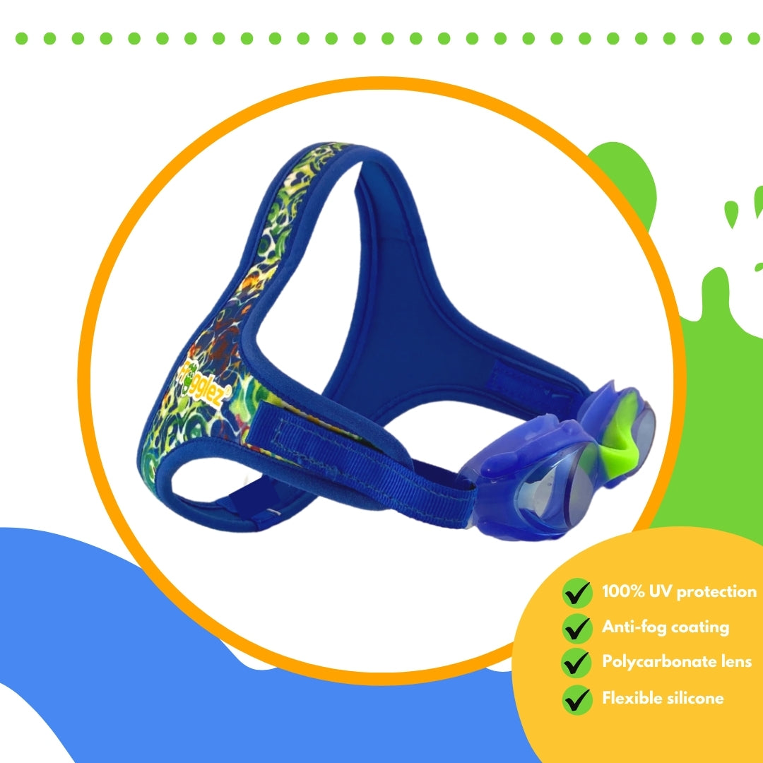 Blue abstract pattern Wavez Frogglez swimming goggles with blue lenses and green nose bridge on white background surrounded by orange circle. Text reads 100% UV protection, anti-fog coating, polycarbonate lens, flexible silicone
