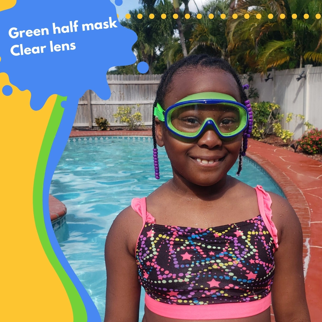 pictured young girl standing at swimming pool wearing frogglez goggles swim mask. text reads green half mask. clear lens.