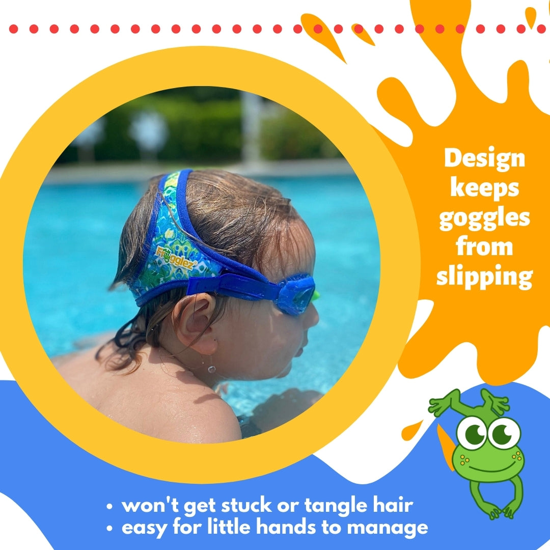 Blonde boy with short haircut wearing blue Frogglez swim goggles facing sideways as he swims in the swimming pool. Text reads: Design keeps goggles from slipping, won't get stuck or tangle hair, easy for little hands to manage