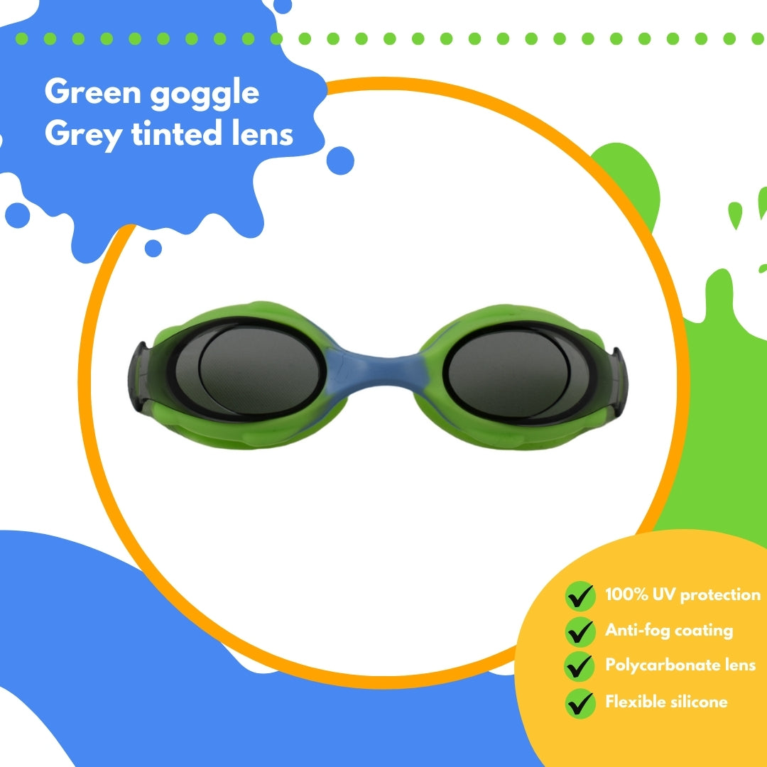 Frogglez green swimming goggles on white background surrounded with an orange circle with text reading: green goggle grey tinted lens. 100% UV protection, anti-fog coating, polycarbonate lens, flexible silicone.